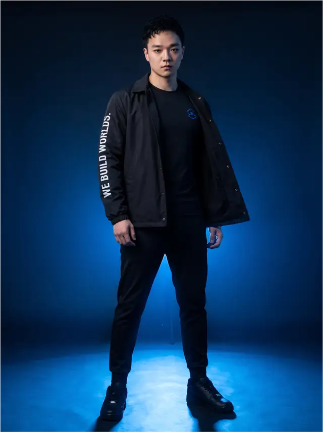 Justin Won in a black LBL coach jacket with a blue chest mark