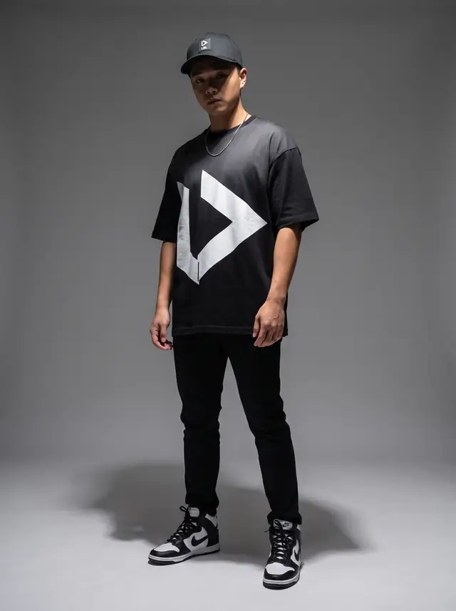 Justin Won in an oversized black tee with LBL chevron and cap
